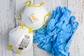 BELLEVUE, WA/USA Ã¢â¬â APRIL 30, 2020: PPE on a rustic white background, 3M N95 mask and blue nitrile gloves